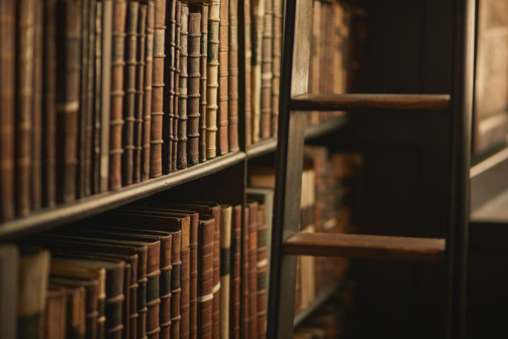 Cropped shot of a large, vintage library full of books
